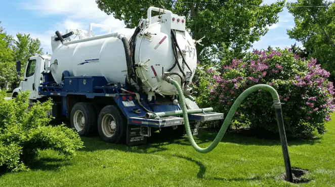 Professional vacuum truck performing residential drainage and septic maintenance in Colorado Springs, CO